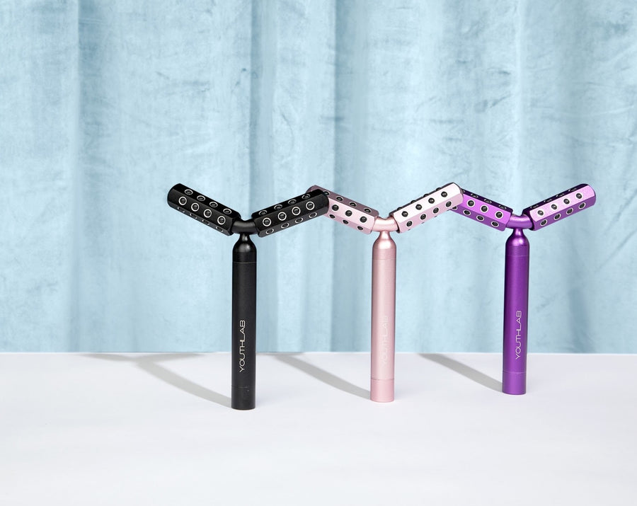 YouthLab Revolution Roller for face and body in black, rose gold and purple.